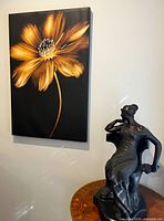 Front view of Christine Zalewski golden flower canvas on wall