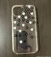 Front view of clear Kate Spade New York floral phone case