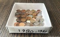 Box with assorted Canadian pennies dated 1980-1989