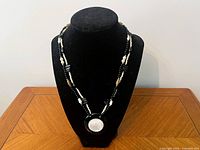 Full view of necklace on display bust