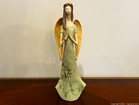 Front view of November’s Angel figurine