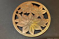 Front view showing flower design and copper finish