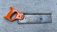 Full view of back saw, blade side up