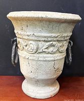 Front view of planter showing relief band and one metal ring