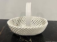 Side view showing braided lattice construction and handle