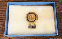 Pin in presentation box on padded insert
