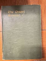 Front cover of The Chapel Hymnal hardcover showing green cloth and gilt title