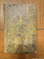Front cover showing gilt Art Nouveau floral design