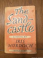 Front of book with dust jacket showing title and author