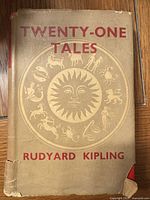 Front of dust jacket showing title, design, and damage