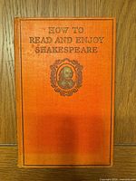 Front cover of orange cloth hardcover with title and portrait