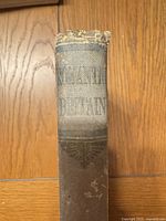 Spine showing title "Beautiful Britain", frayed cloth