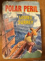Front cover showing title Polar Peril and author Lionel Surrey with illustrated sailing scene; visible creases and wear