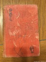 Front cover showing cloth boards with illustrations