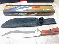 Knife with sheath and box displayed