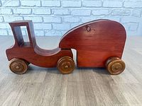 Side view of toy truck and trailer joined