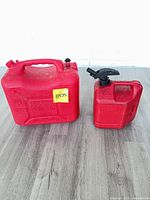 Both gasoline containers side-by-side on floor