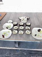 Full layout of dinnerware set on table