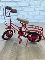 Handmade red metal bicycle statuette, approx 10'' L x 8'' H