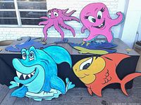 All six ocean creature cut-outs displayed on table