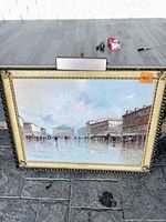 Front view of the framed lighted painting