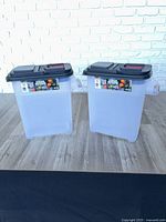 Full view of both plastic storage dispensers side by side