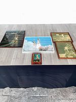 All five NASA pictures arranged on table