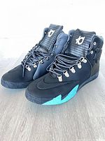 Side angle of both shoes showing overall style, color and KD logo