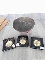 Overall view showing brass bowl on stand and three boxed Chokin plates