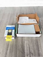 Controller and time switch in their boxes on floor