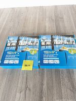 Two sealed Star Mist misting kits on floor