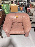 Front view of off-pink faux leather lounge chair