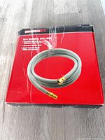 Front view of sealed box showing hose image and branding
