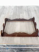 Front view of entire wooden gun rack