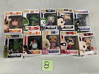 Front view of all 10 boxed Funko Pop! figures