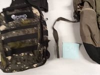 Scipio digital camo sling backpack front view with MOLLE webbing and logo