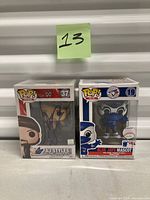 Both boxed Funko Pop figures side by side