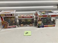 Front view of three boxed Funko Pop sets