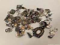 Overview of entire pile of broken silver jewelry pieces