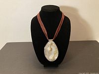 Front view of necklace on display bust