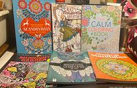 Group shot of all six coloring books front covers