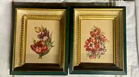Both framed floral prints side by side