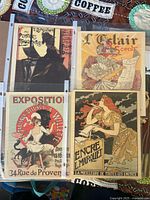 Four 8x10 prints in protective sleeves