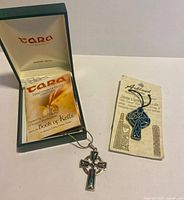 Pendant in Tara box beside Arkland Studios ornament on card