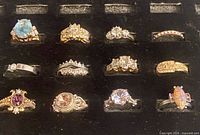 All twelve rings displayed in tray, front view