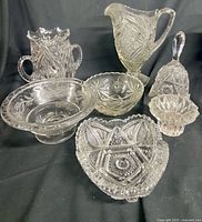 All seven cut glass pieces grouped