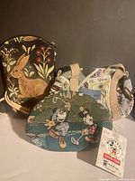 Front view showing rabbit crossbody, Mickey golfer pouch, scenic travel bag