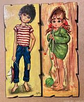 Front view of both plaques showing artwork and overall condition