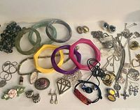 All items laid out showing variety of bracelets, necklaces, earrings and brooch