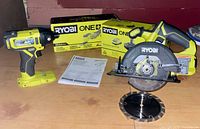Impact driver, circular saw with blade, starter kit box visible